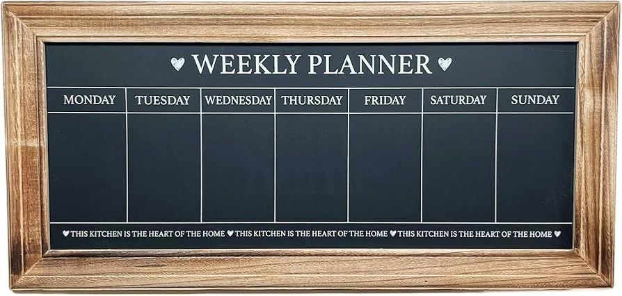 Framed chalkboard wall in kitchen used for menu and grocery list.