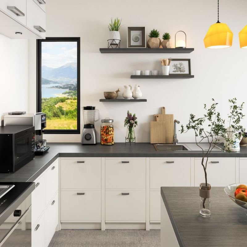 Floating kitchen shelves displaying cookbooks, glass jars, and decorative bowls.