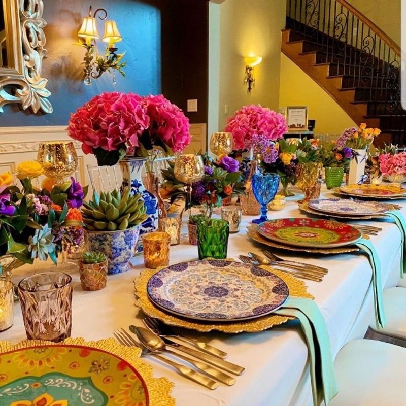 Maximalist table decor with layered textures, bold colors, and rich styling