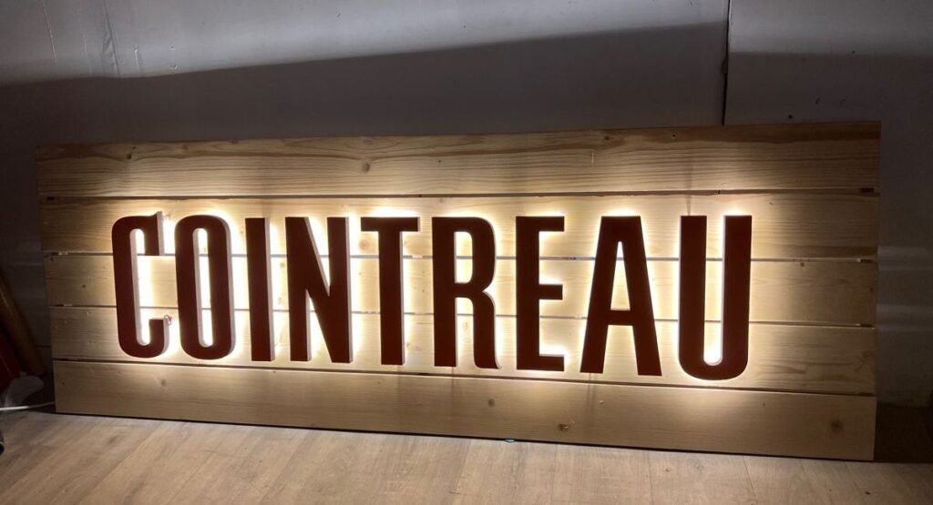 "Rustic farmhouse dining room wall decor with wooden frames and vintage accents"