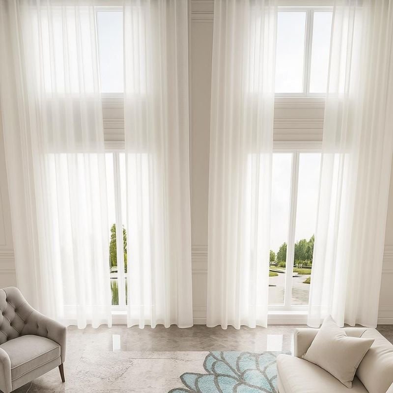 “White sheer curtains in a bright modern living room”