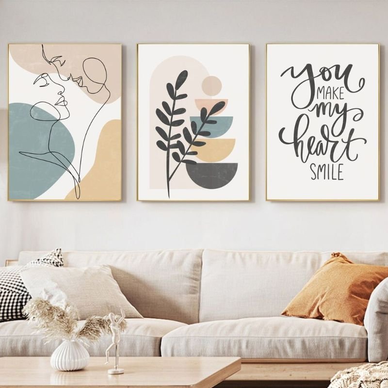 “DIY wall art and printable frames used for budget friendly living room decoration ideas”