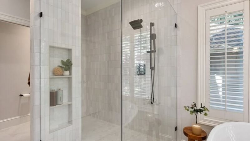 Walk in shower with geometric tile design