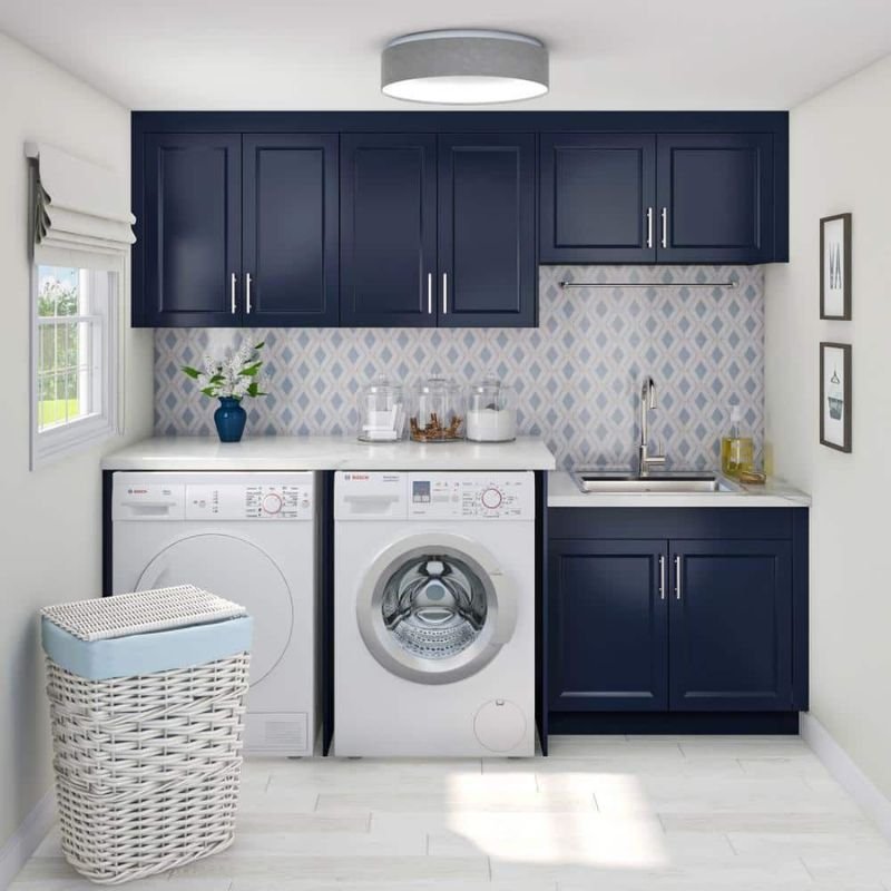 Trendy shaker style laundry room cabinets with modern storage layout