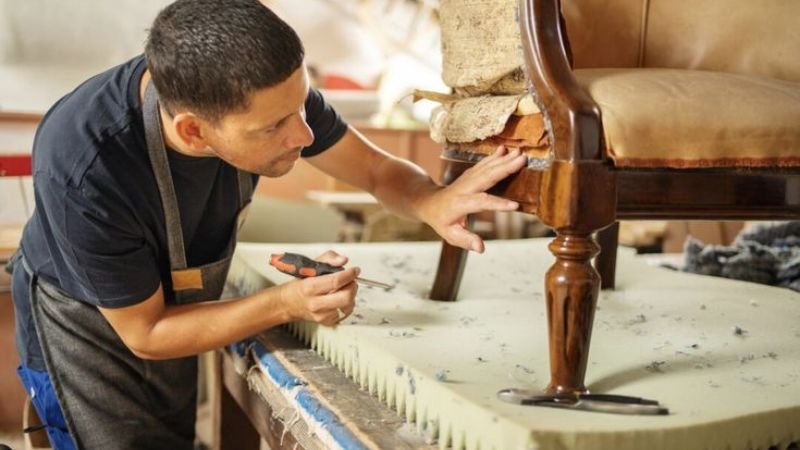 “Buyer inspecting quality and condition of used furniture”
