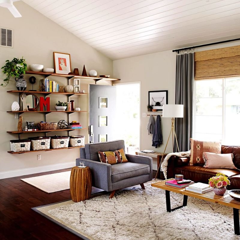 Smart storage solutions for a small living room with baskets and built-in shelving