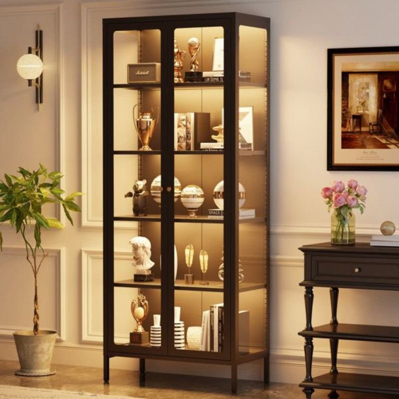 Elegant display cabinet with glass doors showcasing books and decorative items