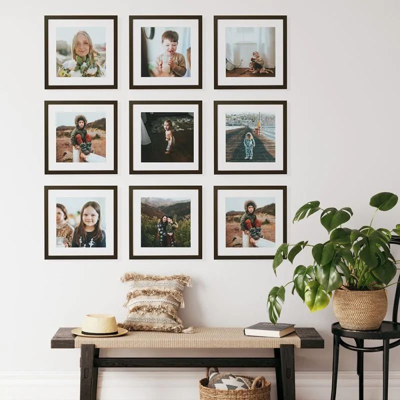 Symmetrical grid of black picture frames