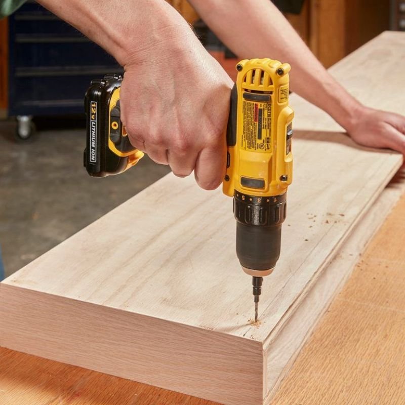 Installing a floating shelf using wall studs and a level