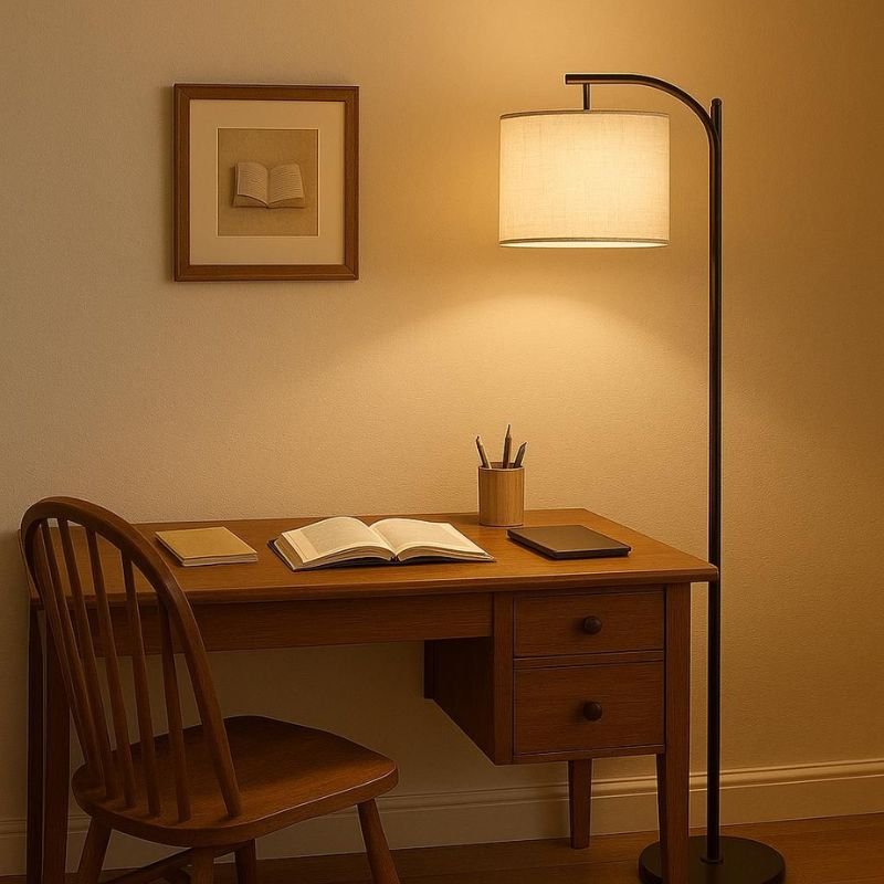 Adjustable reading floor lamp next to a comfortable chair